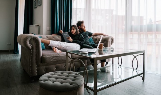 Couple sitting in their living room 